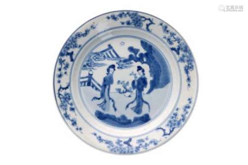 A blue and white porcelain deep dish, decorated with long Elizas in a garden and prunus flowers.