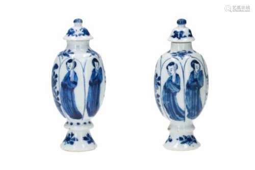 A pair of blue and white porcelain lidded miniature vases, decorated with long Elizas and flowers.