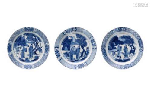 A set of three blue and white porcelain dishes, decorated with figures and a horse. Marked with 6-