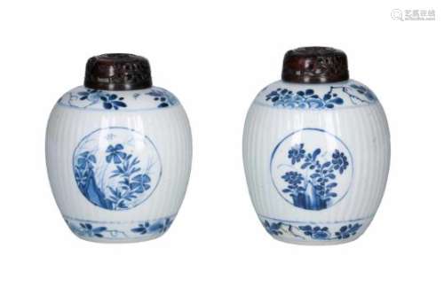 A pair of blue and white porcelain ginger jars with wooden lid, decorated with flowers. Unmarked.