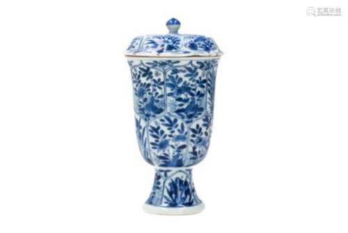 A blue and white porcelain lidded cup on elevated ring, decorated with birds and flowers.