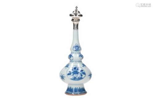 A blue and white porcelain sprinkler vase with silver mounting, decorated with flowers and