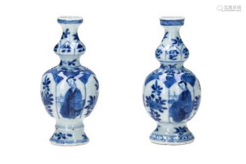 A pair of blue and white porcelain miniature vases, decorated with long Elizas and flowers. Marked
