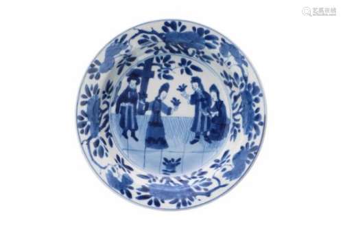 A blue and white Chine de Commande porcelain deep saucer, decorated with figures and flowers. Marked
