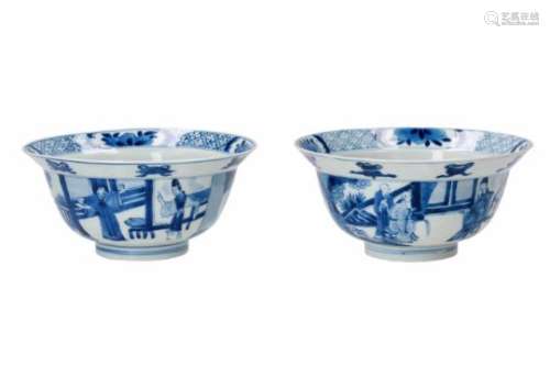 A pair of blue and white porcelain bowls, decorated with figures on a terrace, little boys and