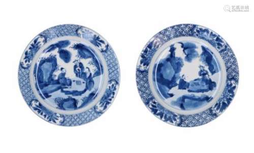 Two blue and white porcelain dishes, decorated with figures in a garden. Marked with 4-character