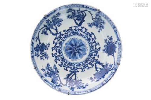A blue and white porcelain deep charger, decorated with flowers. Marked with artemisia leaf.