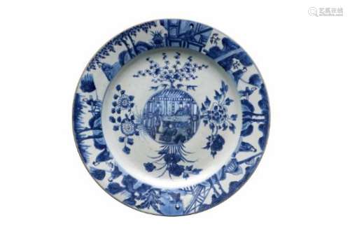A blue and white porcelain charger with elevated center, decorated with flowers and figures in a