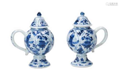 A pair of blue and white porcelain mustard jars, decorated with figures, flowers and little boys.