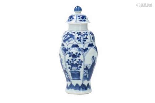 A blue and white porcelain lidded jar, decorated with long Elizas, flowers and little boys. Marked