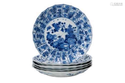 A set of five blue and white porcelain dishes with lobed rim, decorated with flowers and birds.