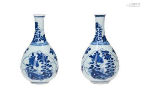 A pair of blue and white porcelain vases, decorated with flowers. Unmarked. China, Kangxi.