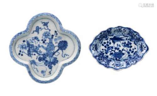 Two blue and white porcelain pattipans with scalloped rim. One decorated with flowers and birds, the