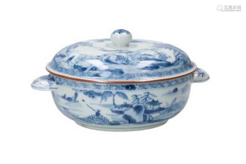 A blue and white porcelain tureen, decorated with figures and pagodas in river landscape.