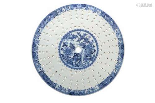 A blue and white porcelain fish trivet, decorated with flowers and a terrace. Unmarked. China,