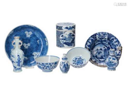 Lot of eight blue and white porcelain objects, including a round lidded jar, a deep dish with silver
