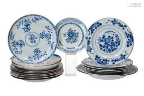 A diverse lot of 17 blue and white porcelain objects, including dishes, deep dishes and a saucer.