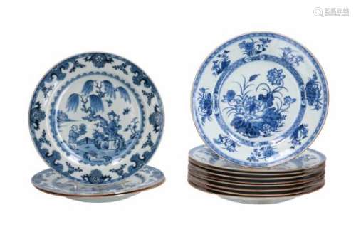 A set of nine blue and white porcelain dishes, decorated with figures in a garden, birds and