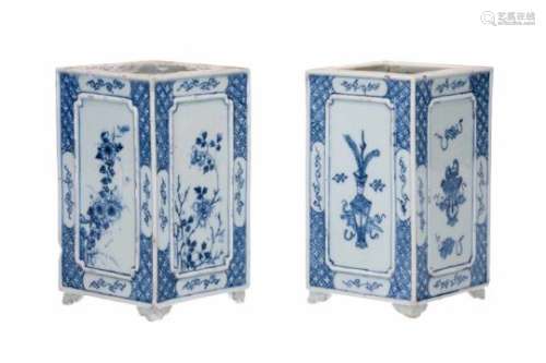 A pair of square blue and white porcelain brush pots, decorated with flowers and antiquities.
