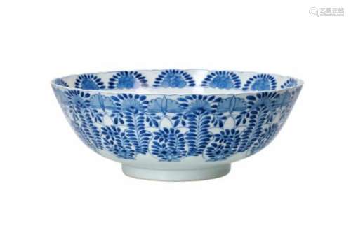 A blue and white porcelain bowl with scalloped rim, decorated with flowers. Marked with 4-