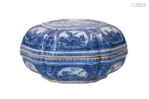 A hexagonal blue and white porcelain lidded box, decorated with flowers and reserves depicting