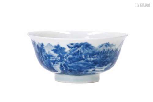 A blue and white porcelain bowl, decorated with a village in a mountainous river landscape. Marked