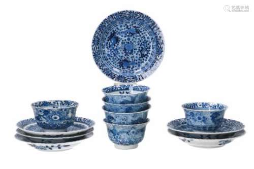 A set of six blue and white porcelain cups with saucers, decorated with flowers, crabs and fish.