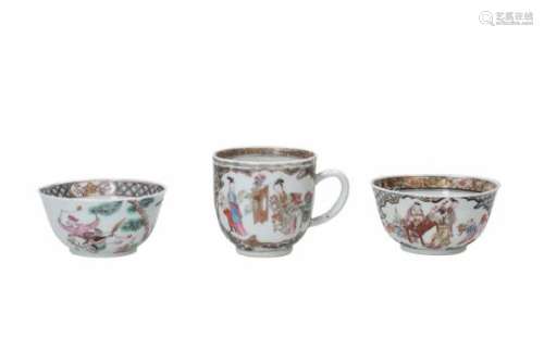 Lot of three famille rose and encre de Chine porcelain cups, decorated with 1) hunters in a