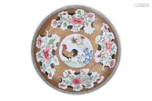 A famille rose, gilded and encre de Chine porcelain deep dish, decorated with a rooster and flowers.