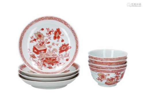 A set of four red and white porcelain cups with saucers, decorated with flower vases. Unmarked.