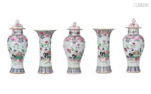 A five-piece famille rose porcelain garniture, decorated with flowers and antiquities. Unmarked.