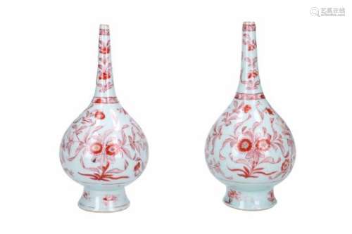 A pair of iron red and white porcelain sprinkler vases, decorated with flowers. Unmarked. China,