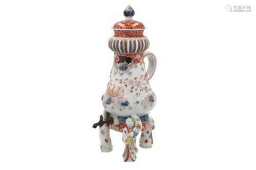 A polychrome porcelain lidded jug with tap, decorated in relief with birds and flowers. The three