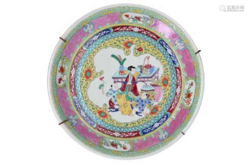 A polychrome porcelain charger, decorated with long Elizas and little boys. Marked with 6-