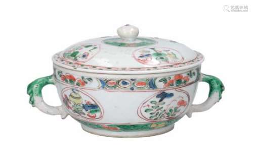 A famille verte porcelain tureen, decorated with reserves depicting flowers and antiquities.