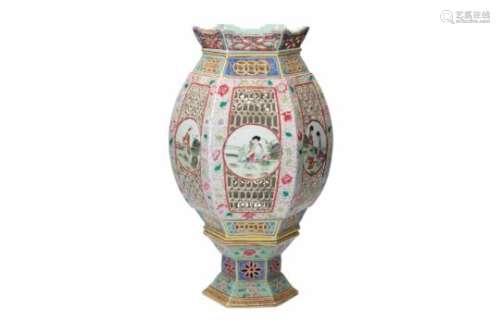 A polychrome porcelain lantern on porcelain stand, decorated with flowers and reserves depicting