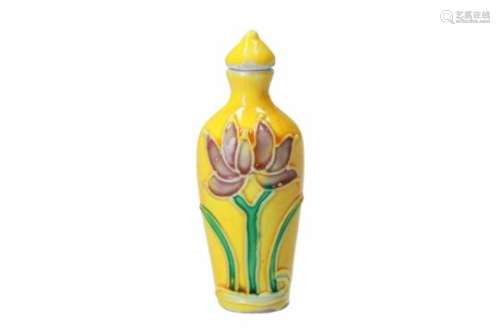A polychrome porcelain snuffbottle, decorated with a flower. Marked with 6-character mark Kangxi.