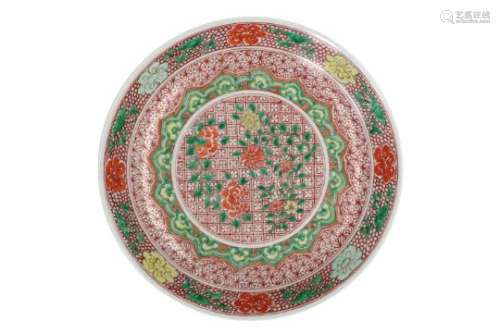 A famille verte porcelain deep charger with geometric decor of flowers. Unmarked. China, 19th