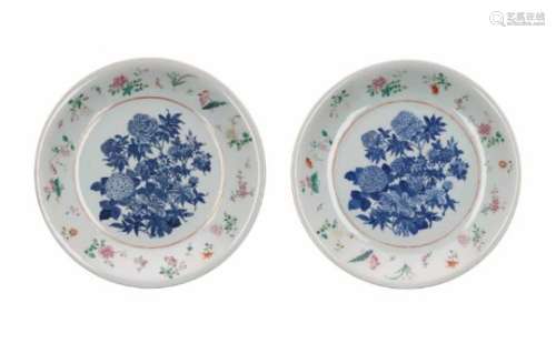 A pair of polychrome porcelain deep chargers, decorated with flowers. Unmarked. China, 20th