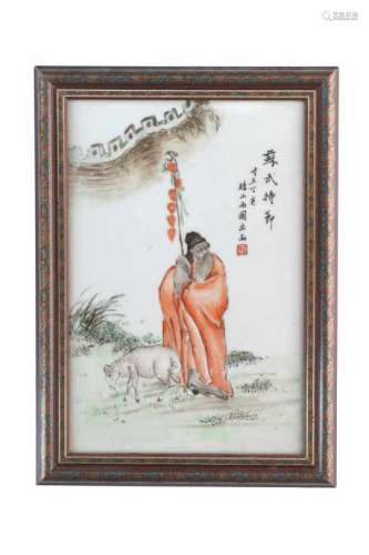 A polychrome porcelain plaque in frame, depicting a man with a ram and characters. China, 1948.