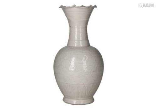 A qingbai glazed porcelain bottle vase with scalloped flaring neck, decorated with flowers and