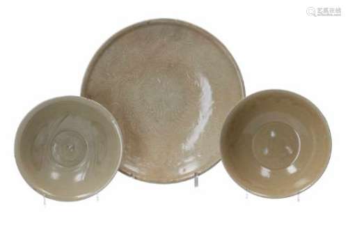 Lot of two celadon glazed bowls and one deep dish. The dish with incised decor of flowers and