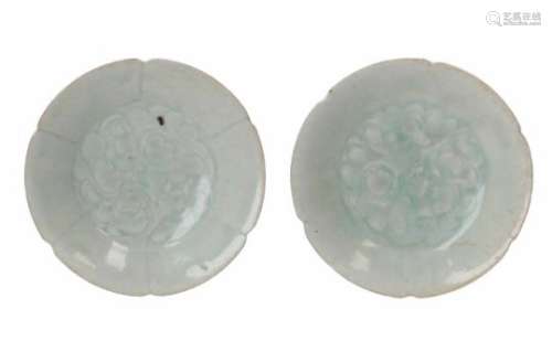 A pair of celadon glazed porcelain saucers with scalloped rim, decorated with leaves. Unmarked.