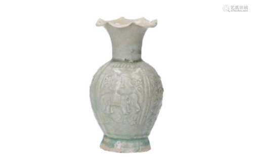 A qingbai porcelain vase with scalloped rim, decorated in relief with elephants, lions and