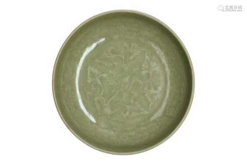 A celadon earthenware deep saucer with underglaze decor of flowers. Unmarked. China, Song/Yuan,