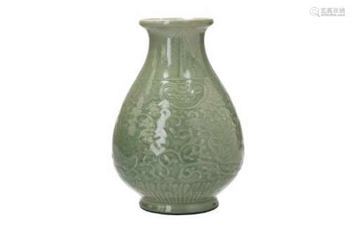 A celadon glazed porcelain vase (turned into a lamp), decorated with two dragons. Marked with 6-