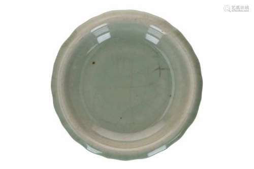 A celadon glazed bowl with scalloped rim. Unmarked. China, Qing, 19th century.