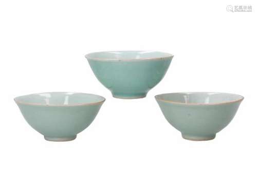 A set of three celadon glazed porcelain cups. Marked with seal mark. China, Qing.