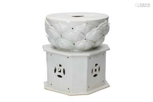 A blanc de Chine porcelain incense burner in the shape of a stove with a chrysanthemum-shaped