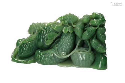 A carved jade sculpture of fruits and a grasshopper. China, 20th century. In box.